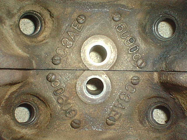 Close-up of casting numbers stamped on engine cylinder heads