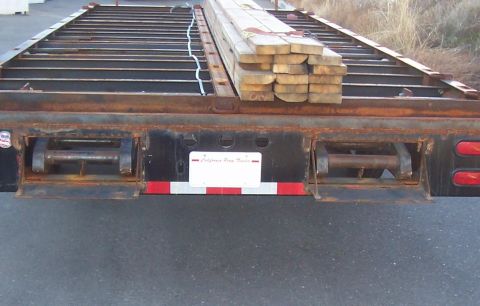 1979 Ford F-350 - both ramps stored in rear of trailer, under deck. The big 10" I-beam frame hides the ramps completly when there stored under here