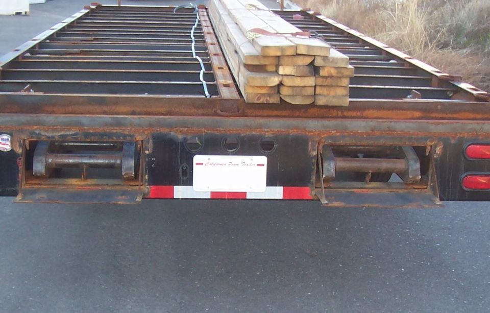 both ramps stored in rear of trailer, under deck.
The big 10" I-beam frame hides the ramps completly when there stored under here
