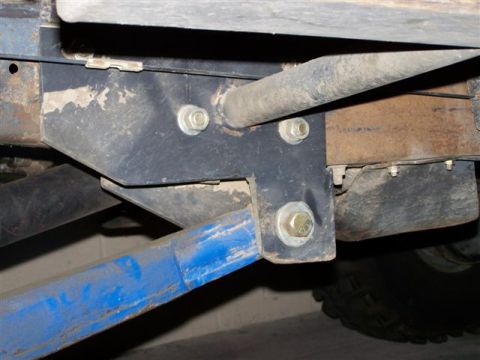 1995 Ford Bronco - Close-up view of vehicle frame and suspension components, likely the rear axle area.