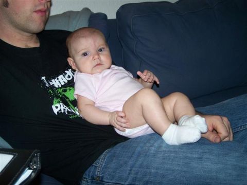 1995 Ford Bronco - A baby is held by a person on a couch, with a website URL visible at the bottom right.