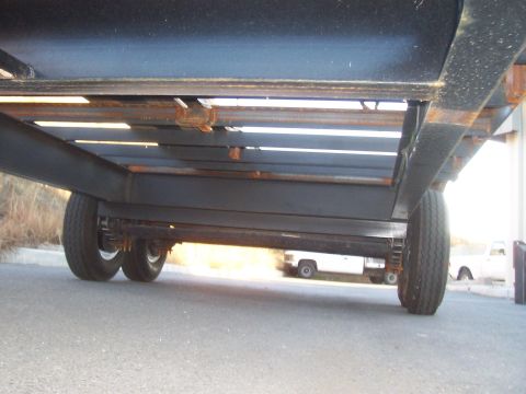1979 Ford F-350 - underneath trailer from front. Here you can see the 10" I-beam frame and crossmembers, and all the 3" C-channel crossmembers for the deck.…