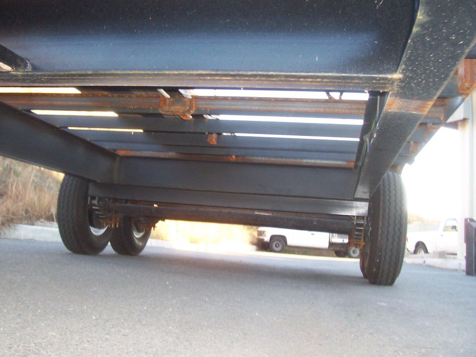 underneath trailer from front. Here you can see the 10" I-beam frame and crossmembers, and all the 3" C-channel crossmembers for the deck.
This is also where the spare tire will go