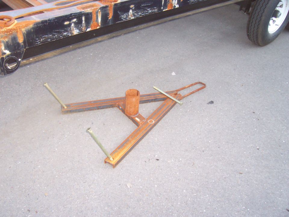 Spare tire cradel. Made from 3" C-channnel, and in a "Y" shape to allow easier reomval of tire. Handle has been extended to allow easier raising and lowering of tire.