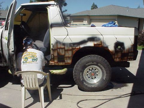 1989 Ford Bronco - This 1989 Ford Bronco is being prepped for a unique paint job, showing rust effects on its side.