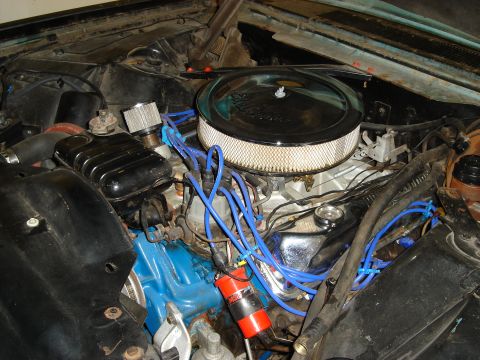 1992 Ford Crown Victoria - Close-up view of an engine bay with various components visible, including an air cleaner and wiring.
