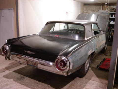 1992 Ford Crown Victoria - This classic Ford Thunderbird is undergoing bodywork in a garage setting.