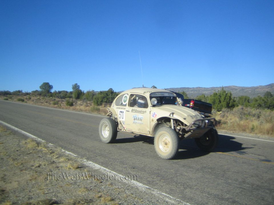 Tan VW Beetle-based off-road race car on rural highway