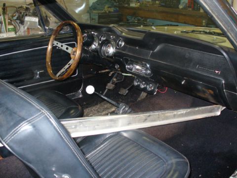 1968 Ford Mustang - Interior view of a 1968 Ford Mustang, highlighting the dashboard and seating.