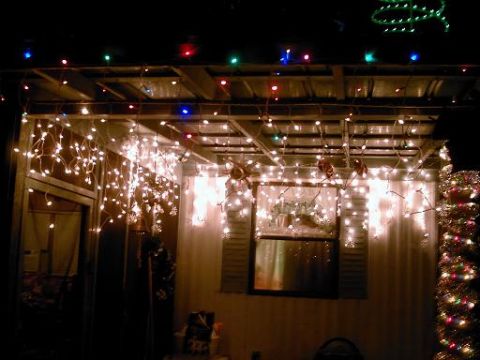 1986 Ford Bronco - A house is covered in Christmas lights, creating a festive scene.