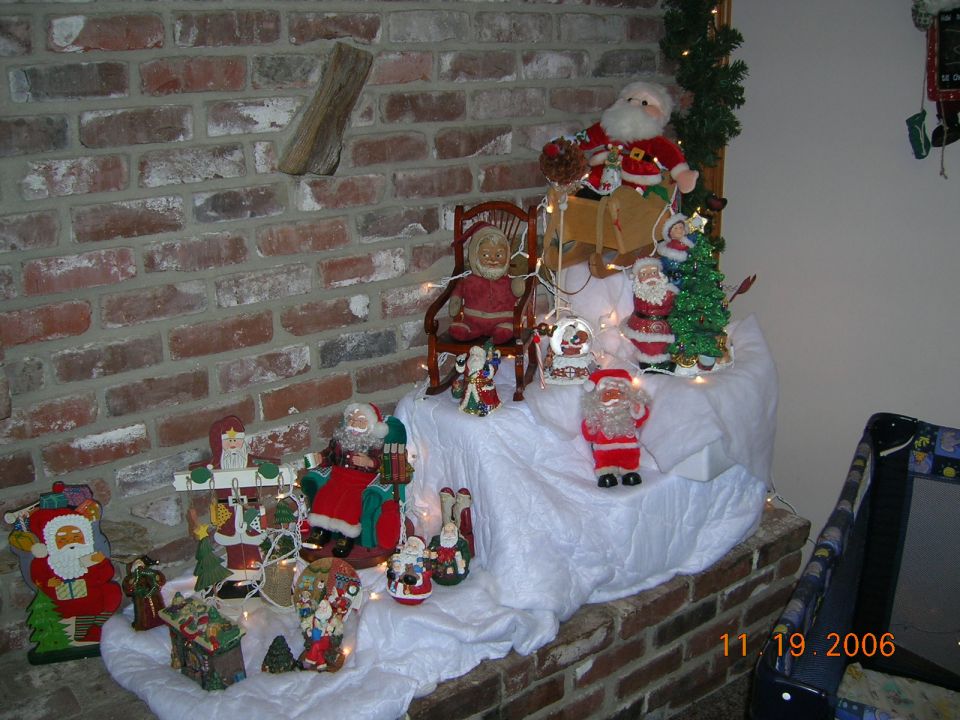Christmas decorations on brick hearth with date 11.19.2006