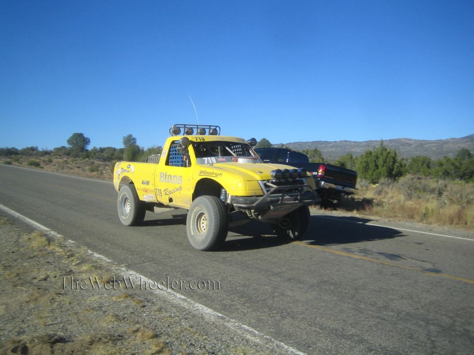 Yellow Pinos Racing off-road race truck on rural highway