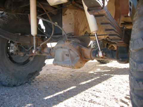 1997 Ford Ranger - Close-up view of the rear axle and suspension system of a truck, showing leaf springs and shock absorbers.