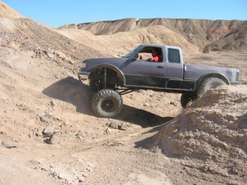 1997 Ford Ranger - Modified 1997 Ford Ranger tackles rough terrain in a desert environment.