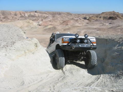 1997 Ford Ranger - This 1997 Ford Ranger is navigating a challenging off-road course in a desert landscape.