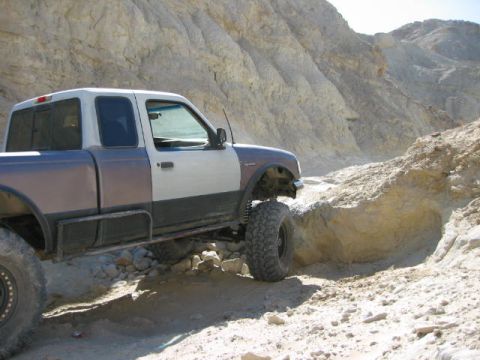 1997 Ford Ranger - This modified Ford Ranger is tackling a challenging off-road course in a desert canyon.