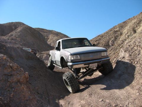 1997 Ford Ranger - Modified 1997 Ford Ranger tackling rough terrain on a sunny day.