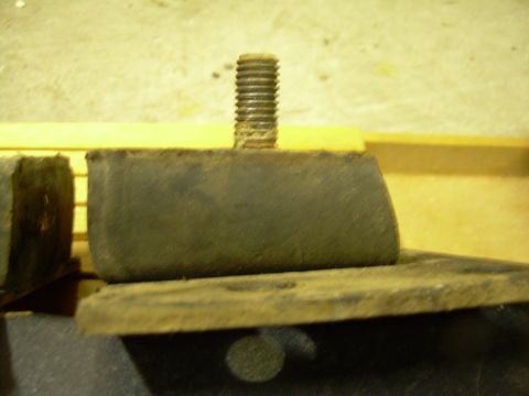 1978 Ford Bronco - These rubber motor mounts appear to be worn and are part of a vehicle's engine assembly.