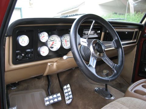 1979 Ford Bronco - Custom gauges and steering wheel in a 1979 Ford Bronco interior.