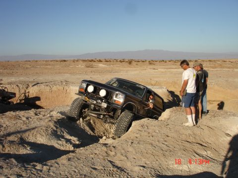 1996 Ford Bronco - Ford Bronco attempting a difficult maneuver in a desert off-road park.