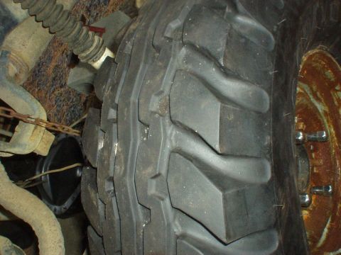 1984 Chevrolet Blazer - This image shows a close-up of an off-road tire and a rusty wheel, not a 1984 Chevrolet Blazer.
