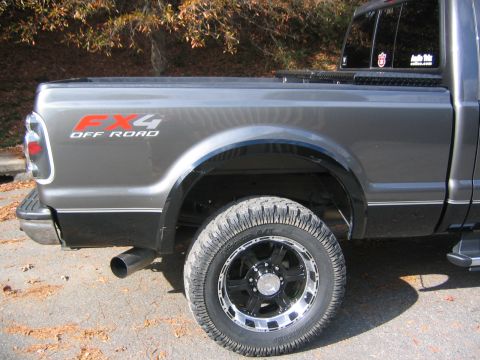 2005 Ford F-250 - This Ford F-250 Super Duty pickup truck features a gray exterior with an FX4 Off Road decal on the rear quarter panel.
