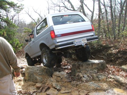 1996 Ford Bronco - 1996 Ford Bronco navigating a rocky off-road trail.