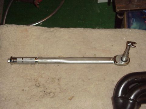 1989 Ford Bronco - A torque wrench and exhaust headers are shown, not a 1989 Ford Bronco.