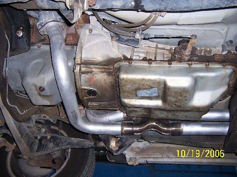 1991 Ford Bronco - Vehicle's transmission and exhaust system components are visible from underneath.