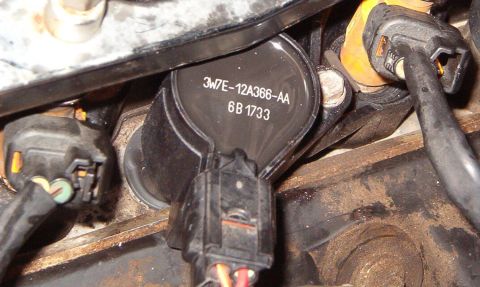 1999 Ford Crown Victoria - The old coil probably still works fine, but I decided to replace it anyway. Same for the spark plug, if I had regapped it, but the boot was…