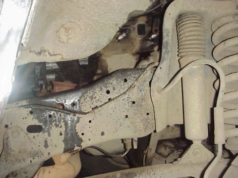 1989 Ford Bronco - Undercarriage view of a vehicle's frame and suspension system, showing structural and mechanical parts.