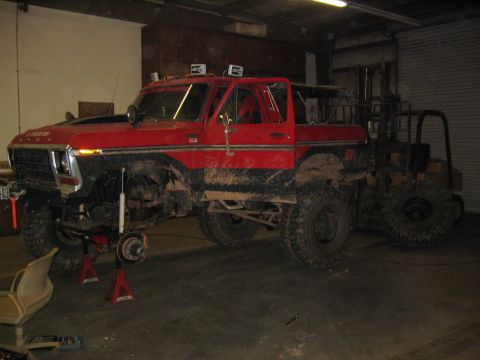 1979 Ford Bronco - This 1979 Ford Bronco is undergoing modifications with its front end raised on jack stands.