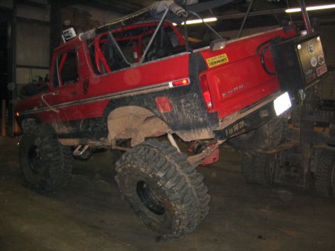 1979 Ford Bronco - This modified Bronco is being worked on or transported, showing its off-road capabilities.