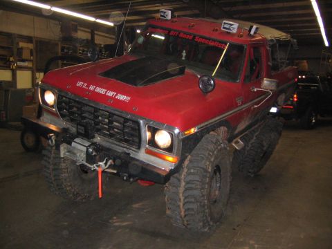 1979 Ford Bronco - This heavily modified truck, likely a 1978 model, is equipped for off-road use with oversized tires and a winch.