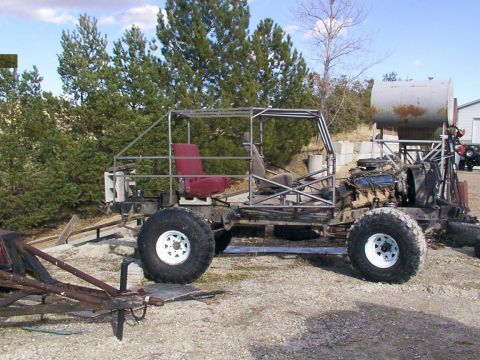 1978 Ford Bronco - This custom-built buggy is in progress, a roll cage and exposed engine components.