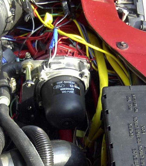 1997 Ford Taurus - Close-up view of a Ford SHO pump within a cluttered engine bay.