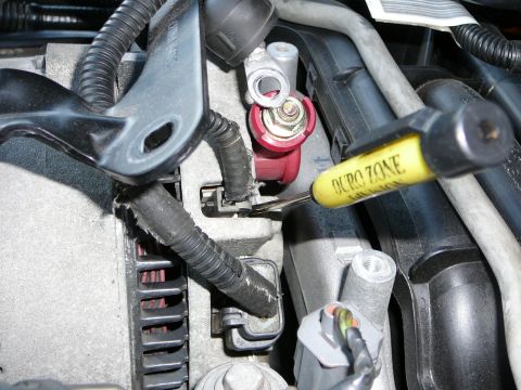 1997 Mercury Grand Marquis - Step 7: With the Alternator bracket unbolted, you now have easier access to the alternator wiring. Remove the 10mm nut and remove the wire.…