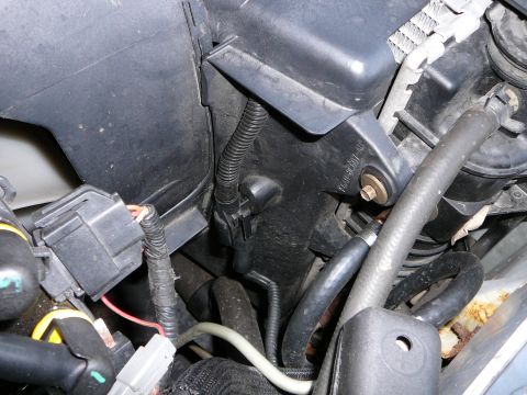 1997 Mercury Grand Marquis - Step 2. Remove the fan shroud. This requires the electric fan wires to be disconnected. There is also 2 8mm bolts to remove. one is located…