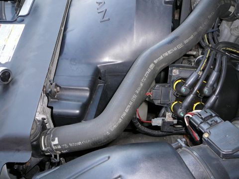 1997 Mercury Grand Marquis - Step 2. Remove the fan shroud. This requires the electric fan wires to be disconnected. There is also 2 8mm bolts to remove. one is located…