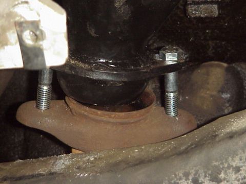 1989 Ford Bronco - This image shows a close-up view of a vehicle's exhaust manifold flange and mounting bolts.