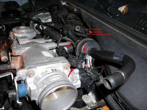 1997 Mercury Grand Marquis - Step 13: Remove the Idle Air Control Valve wire harness. Remove the Throttle Position Sensor Wire harness. Remove the #7 Fuel injector wire…