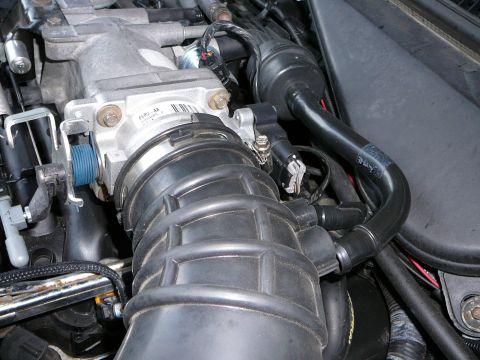 1997 Mercury Grand Marquis - Step 8: Remove the intake Zip tube by loosening the hose clamp on the throttle body and removing both the 2 hoses that enter the backside o…