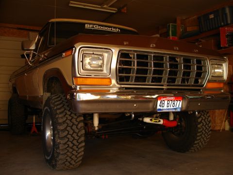 1979 Ford F-150 - Front view of a lifted 1979 Ford F-150 pickup truck parked in a garage.