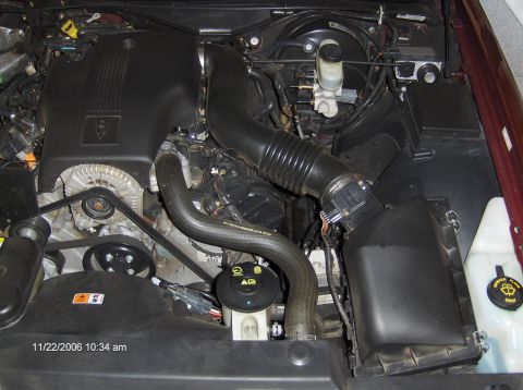 2004 Ford Crown Victoria - Engine bay of a 2004 Ford Crown Victoria, detailing the air intake system and engine components.