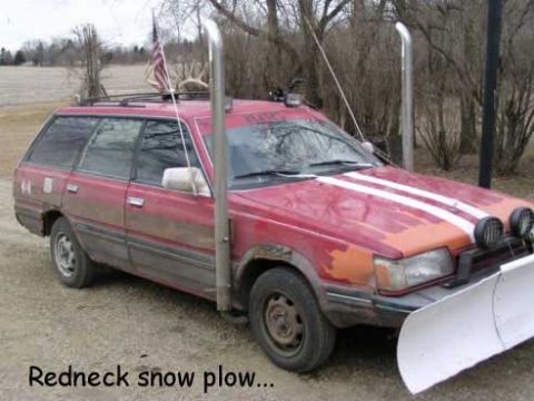 1995 Ford Bronco - This modified station wagon is equipped with a snow plow and stacks, labeled as a 'Redneck snow plow'.