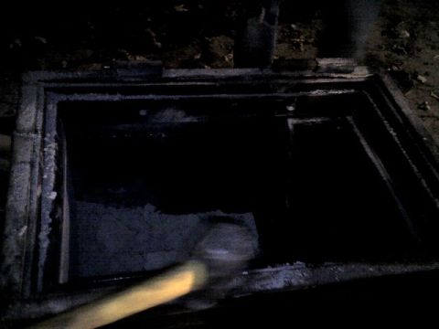 1987 Ford Bronco - An open manhole is visible, with a yellow object in the foreground.