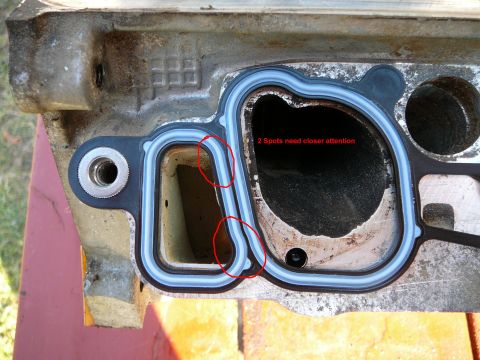 1997 Mercury Grand Marquis - Close-up of an engine intake manifold gasket, with text indicating areas that require closer inspection.