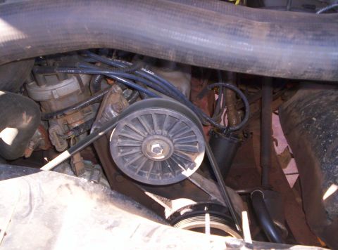 1995 Ford Bronco - This image shows a detailed view of the engine's belt system and distributor, not the exterior of a 1995 Ford Bronco.