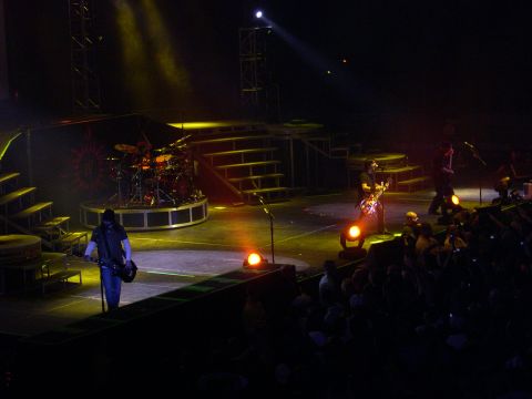 1997 Ford Probe - Live concert performance with band members on stage and audience in the foreground.