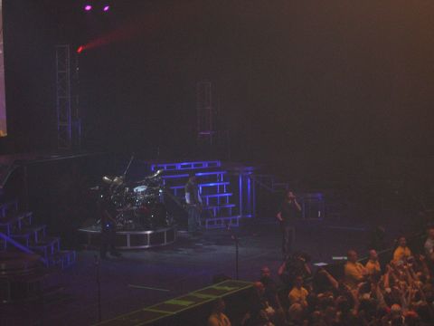 1997 Ford Probe - A concert stage is set up with a drum kit and performers, viewed from above the audience.
